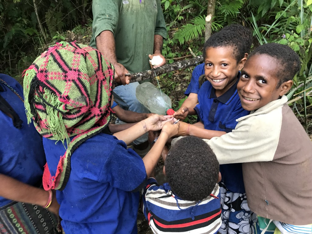 PNG Locals using their tippy tap to wash their hands
